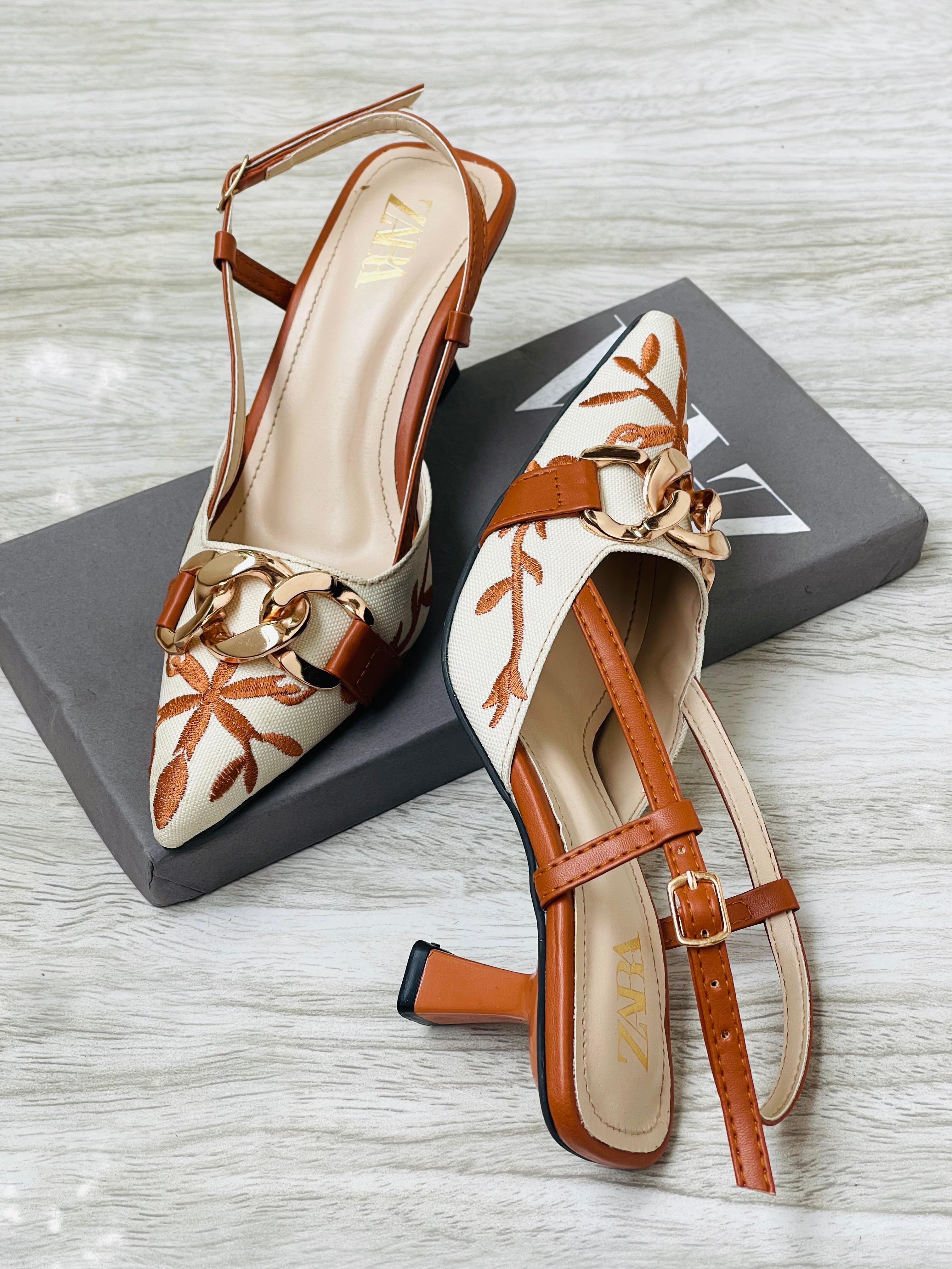 Leaf pattern buckle heel