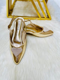 JC gold pumps