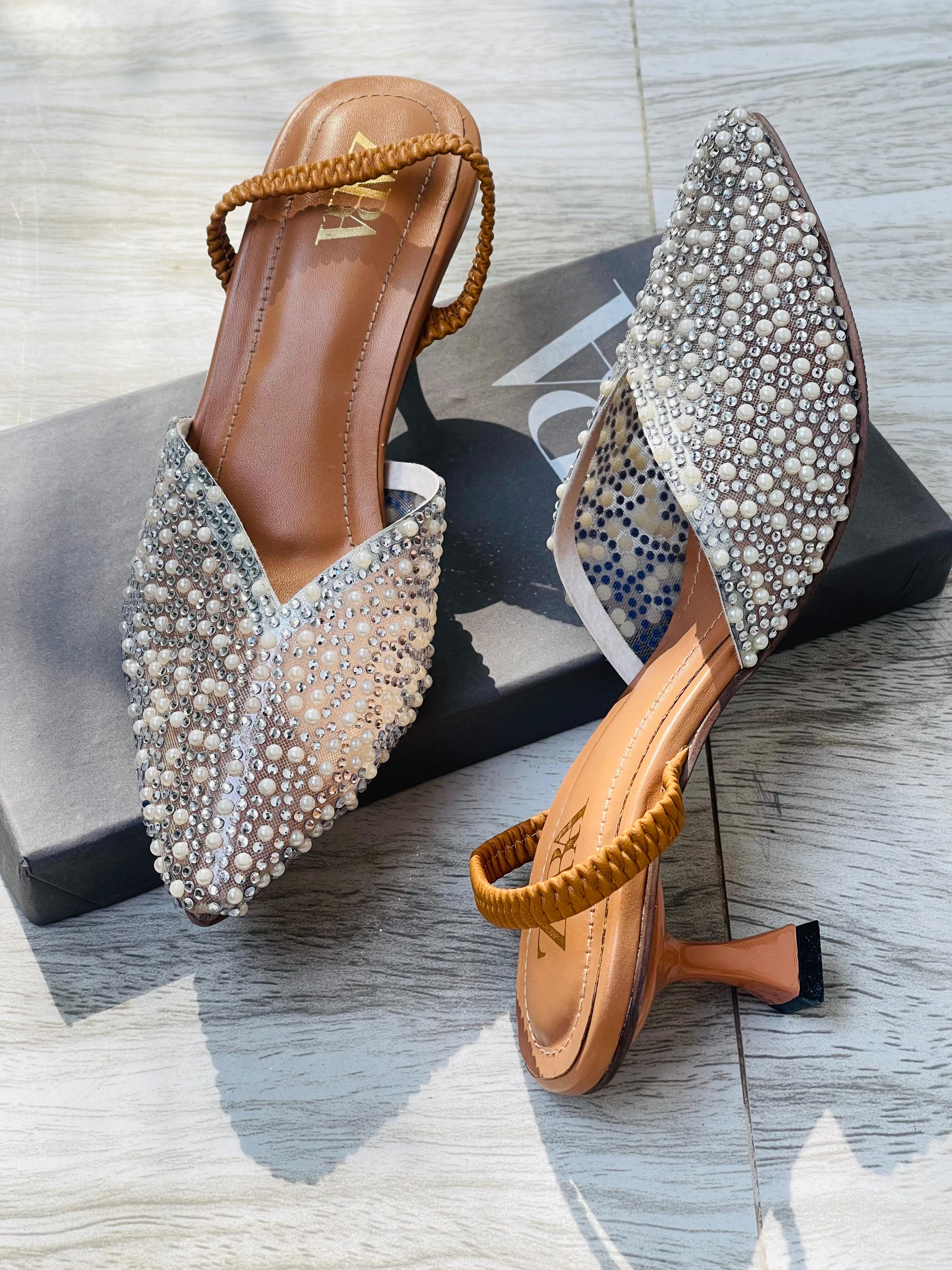 Transparent white pearl heels